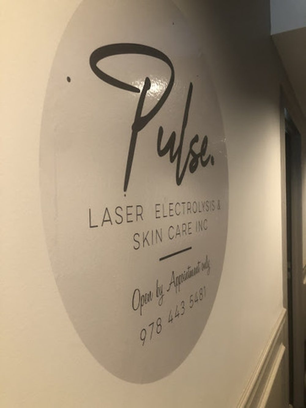 A modern skin care center with a pulse laser treatment machine.